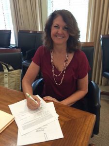 Chair, Diane Murphy, Signing Lease to Purchase Agreement with the Eureka Springs School District