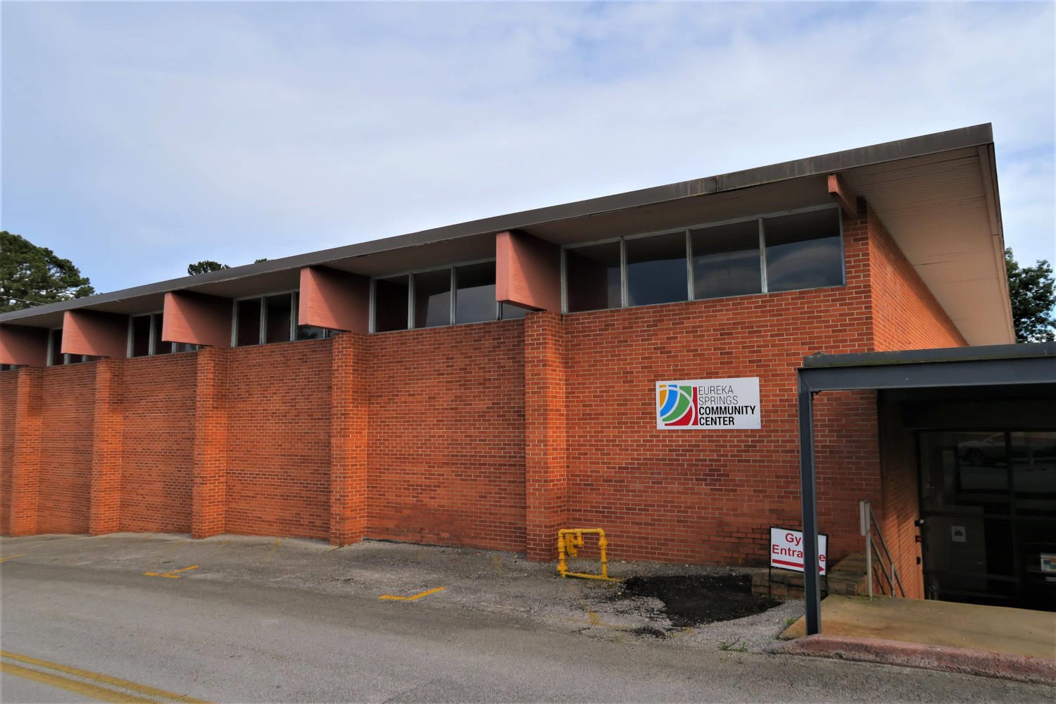 Exterior view of gym, front entrance, with ESCC sign visible