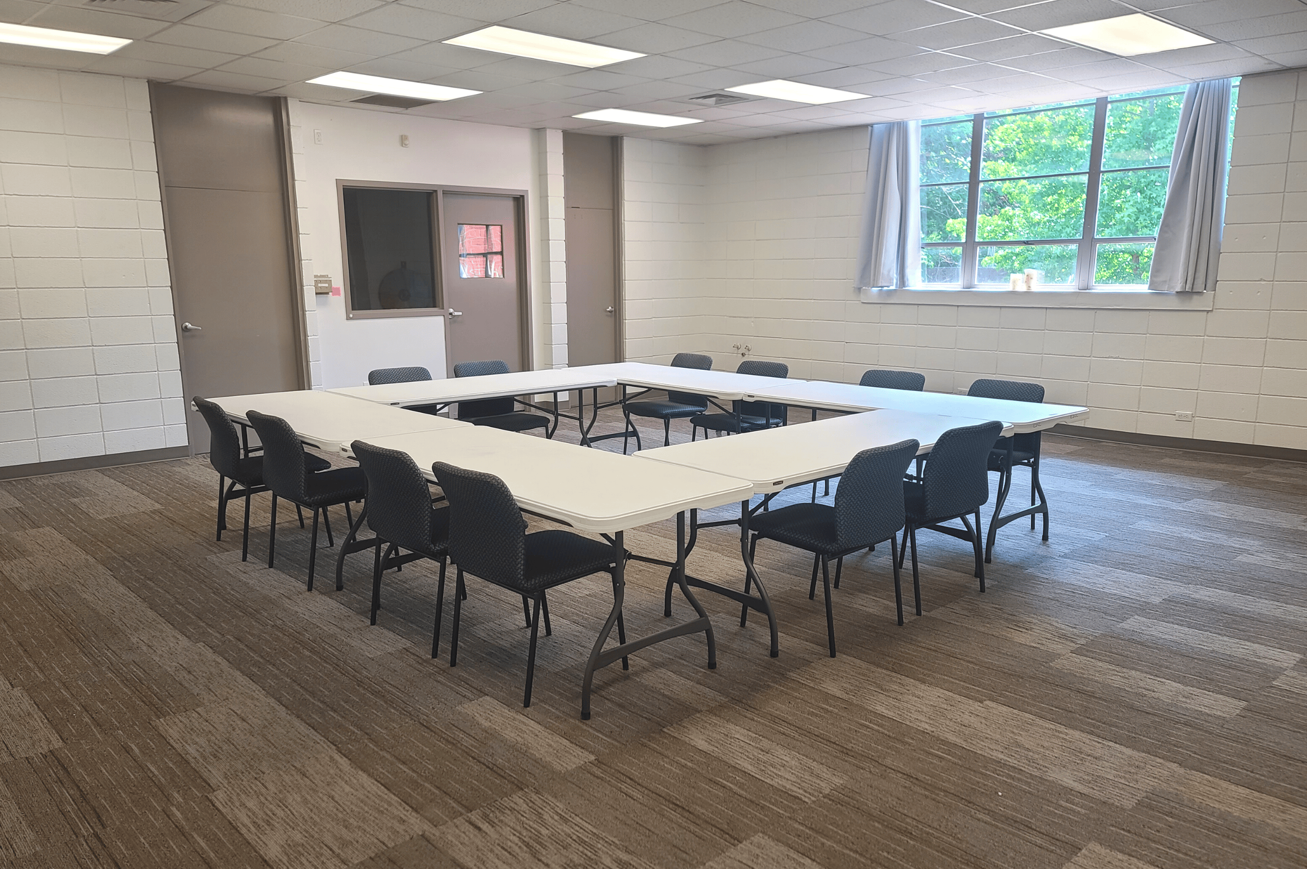 photo of table and chairs set up for a meeting