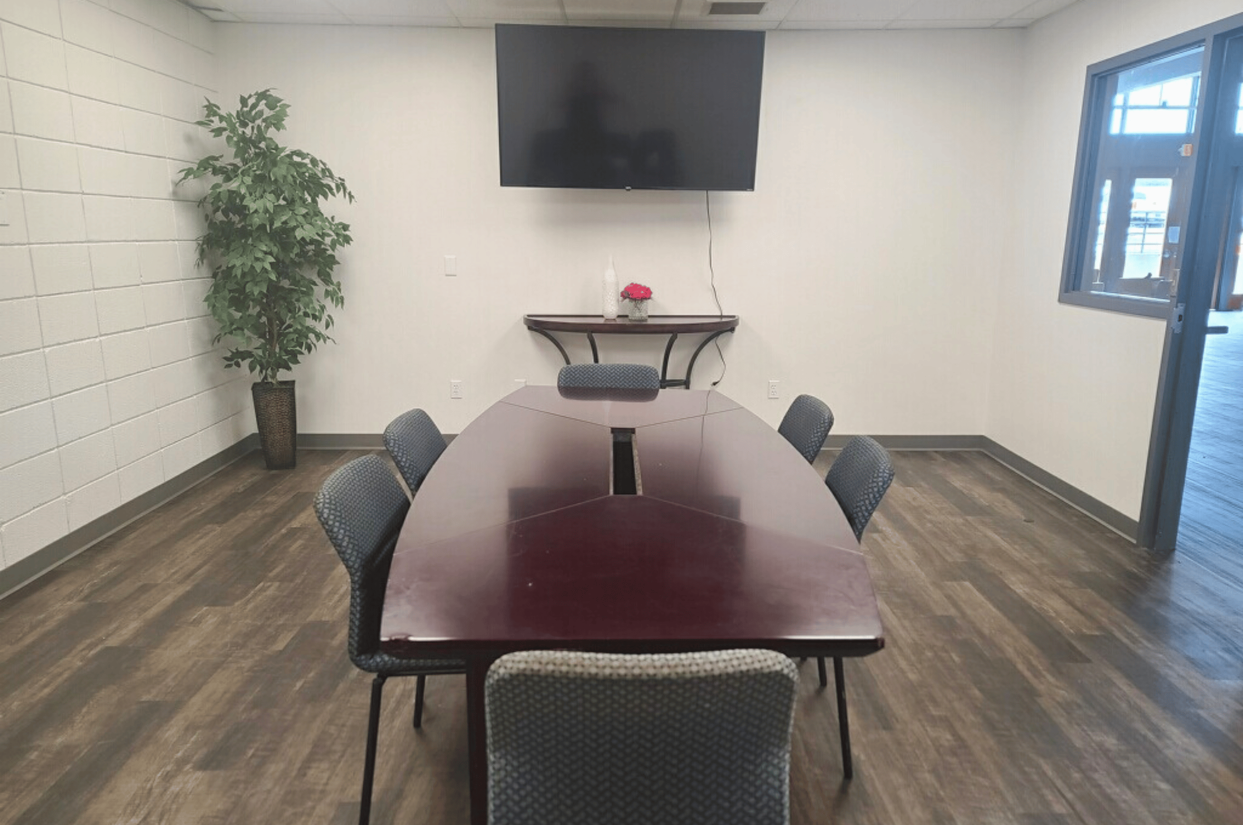 Conference Room with long table and chairs around it