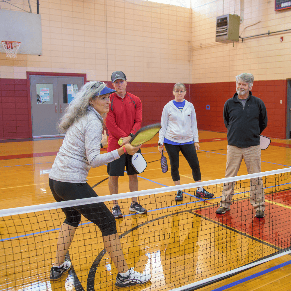 pickleball instructor with students