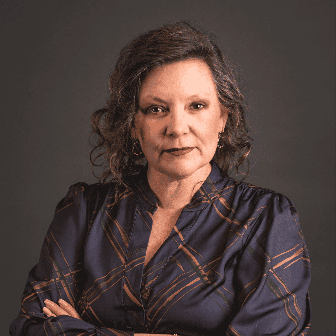 headshot, woman, arms crossed, looking straight into camera