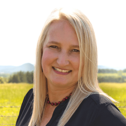 smiling woman outdoors in field