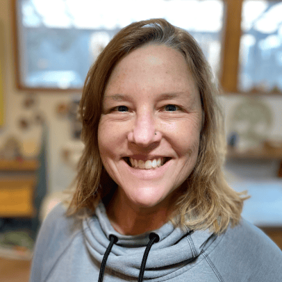 Woman smiling in a garden shop